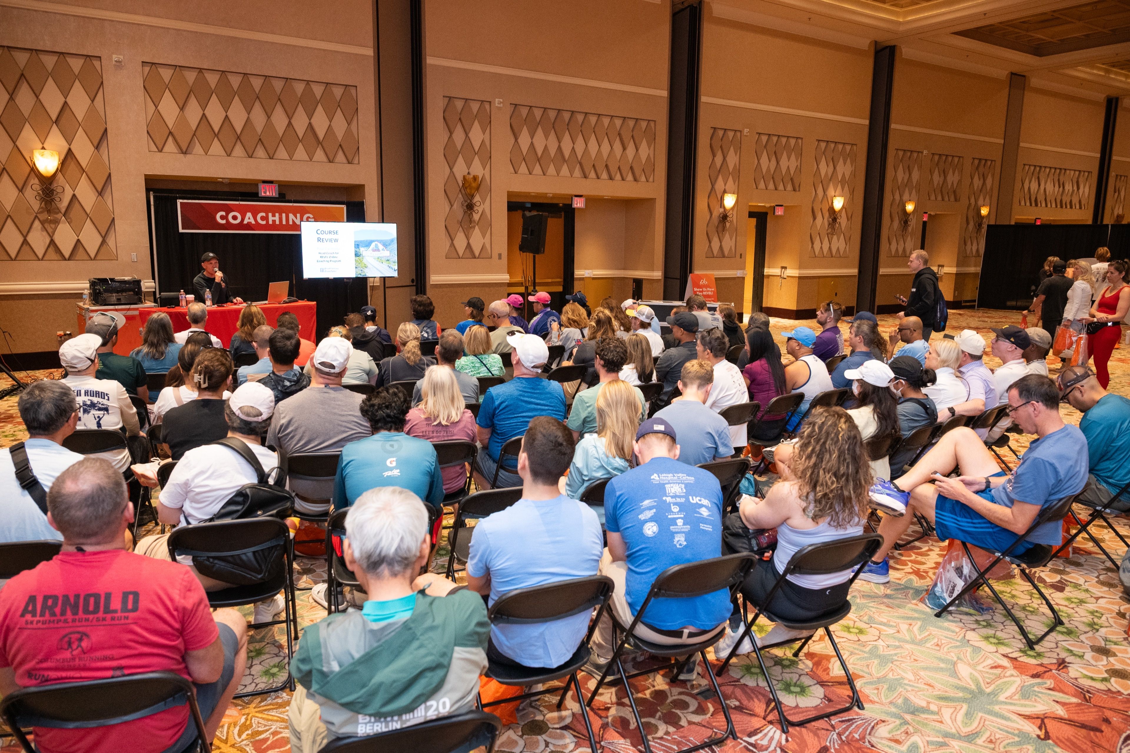 Keynote speaker on stage at a Las Vegas conference