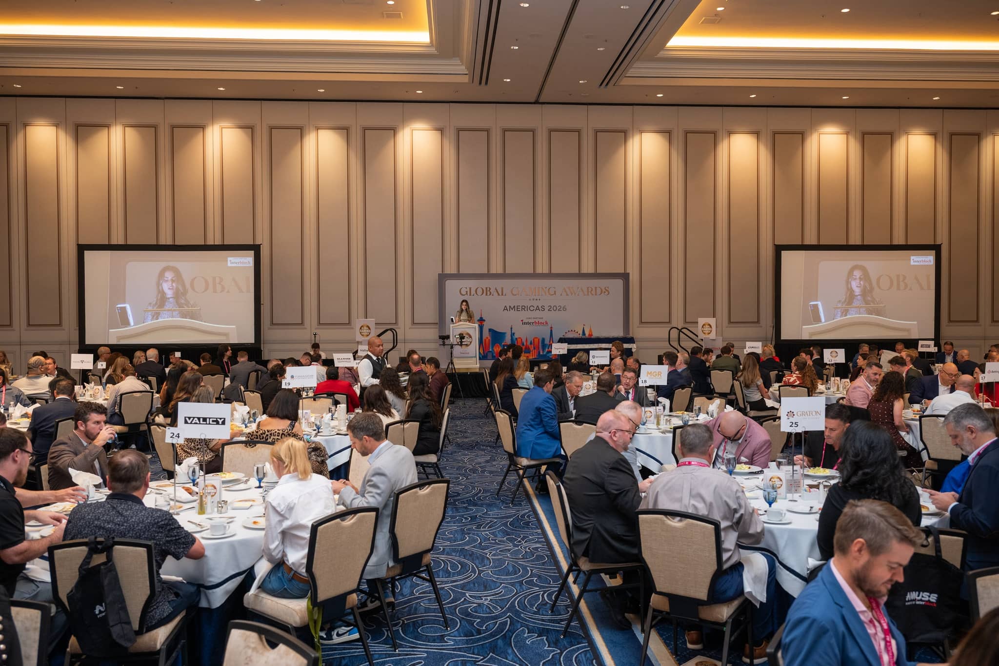 Audience seated facing the stage and screens at the Global Gaming Awards Americas 2026