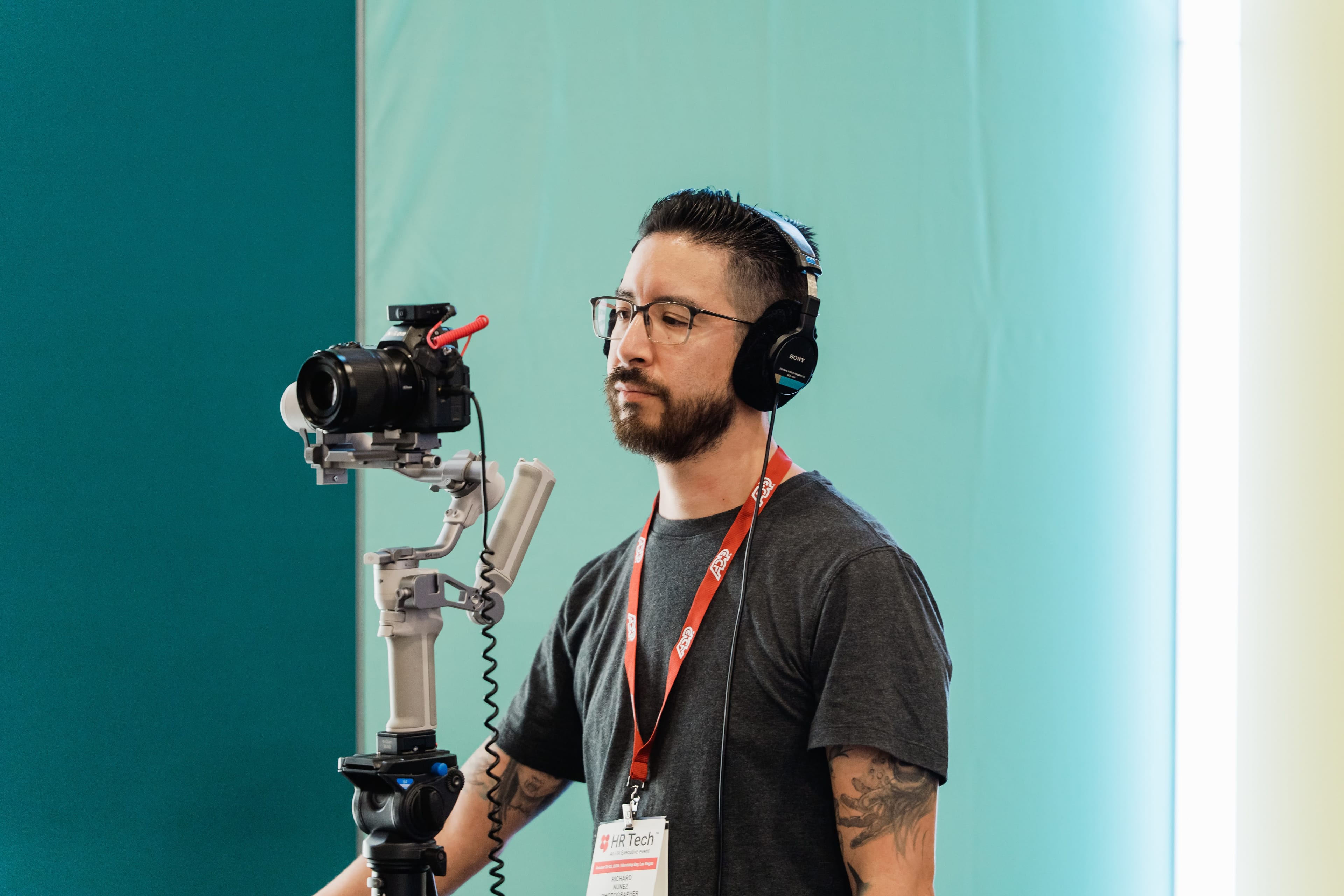 Richard framing a shot on a gimbal at HR Tech