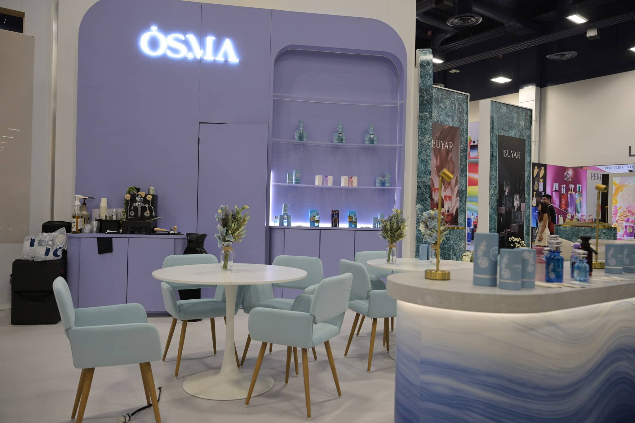 OSMA fragrance display with a meeting table and seating